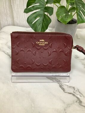 GUC Coach Embossed Signature Leather Wristlet in Burgundy with Gold Hardware